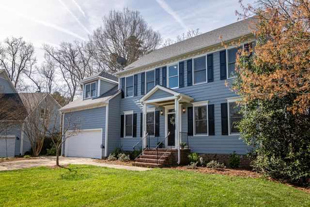 exterior painted blue house from front yard
