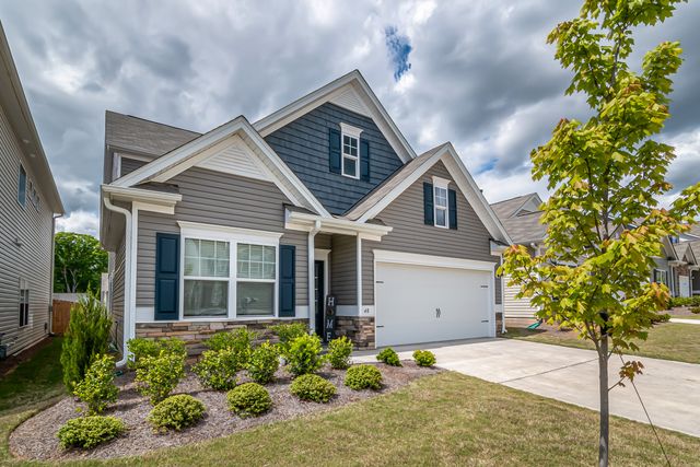 grey house from front yard view with new exterior painting