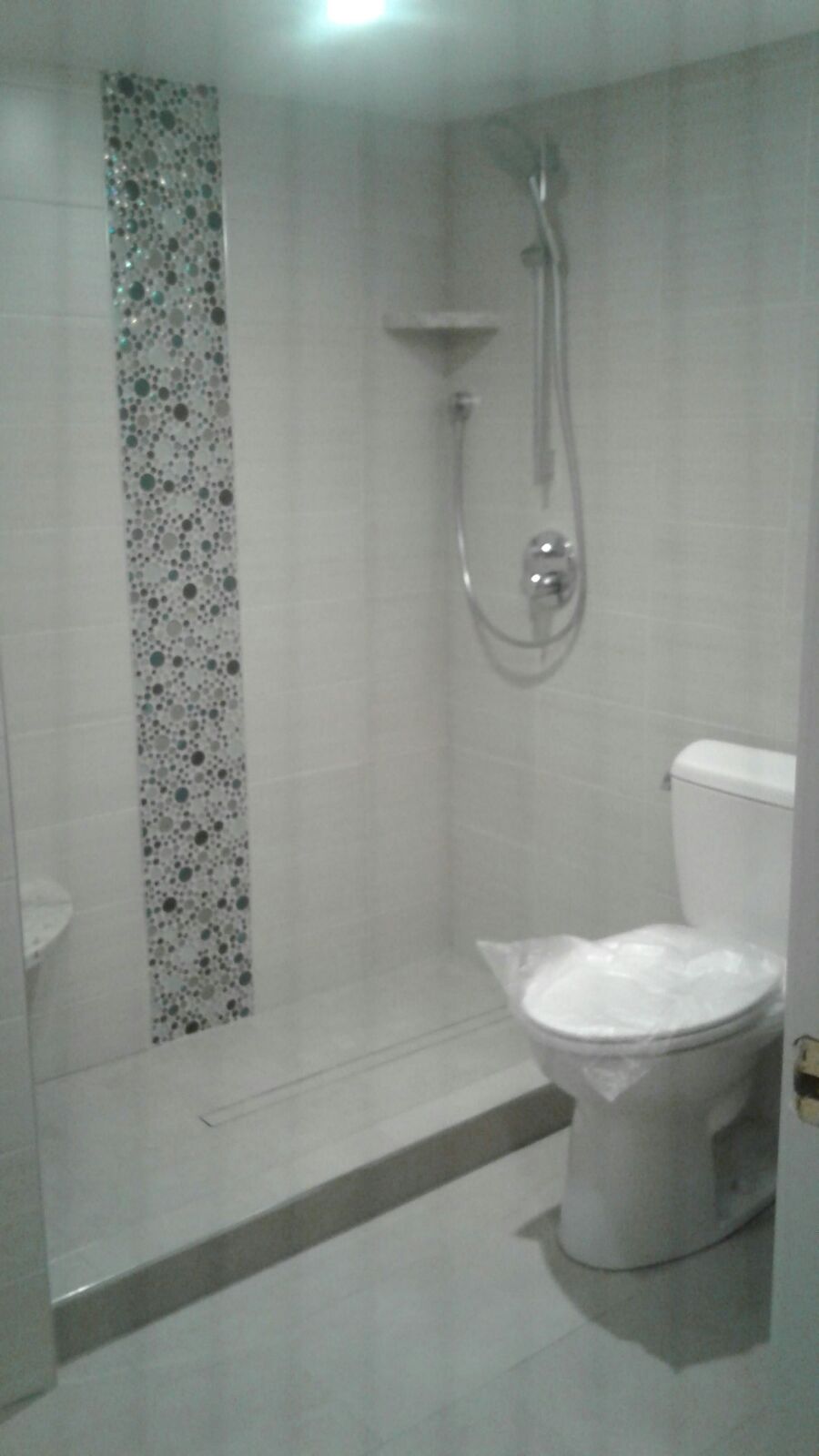 artisanal tile design and white ceramic tile in shower