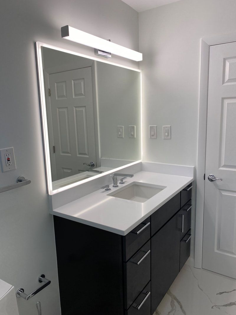 New bathroom vanity and ceramic tile installation completion