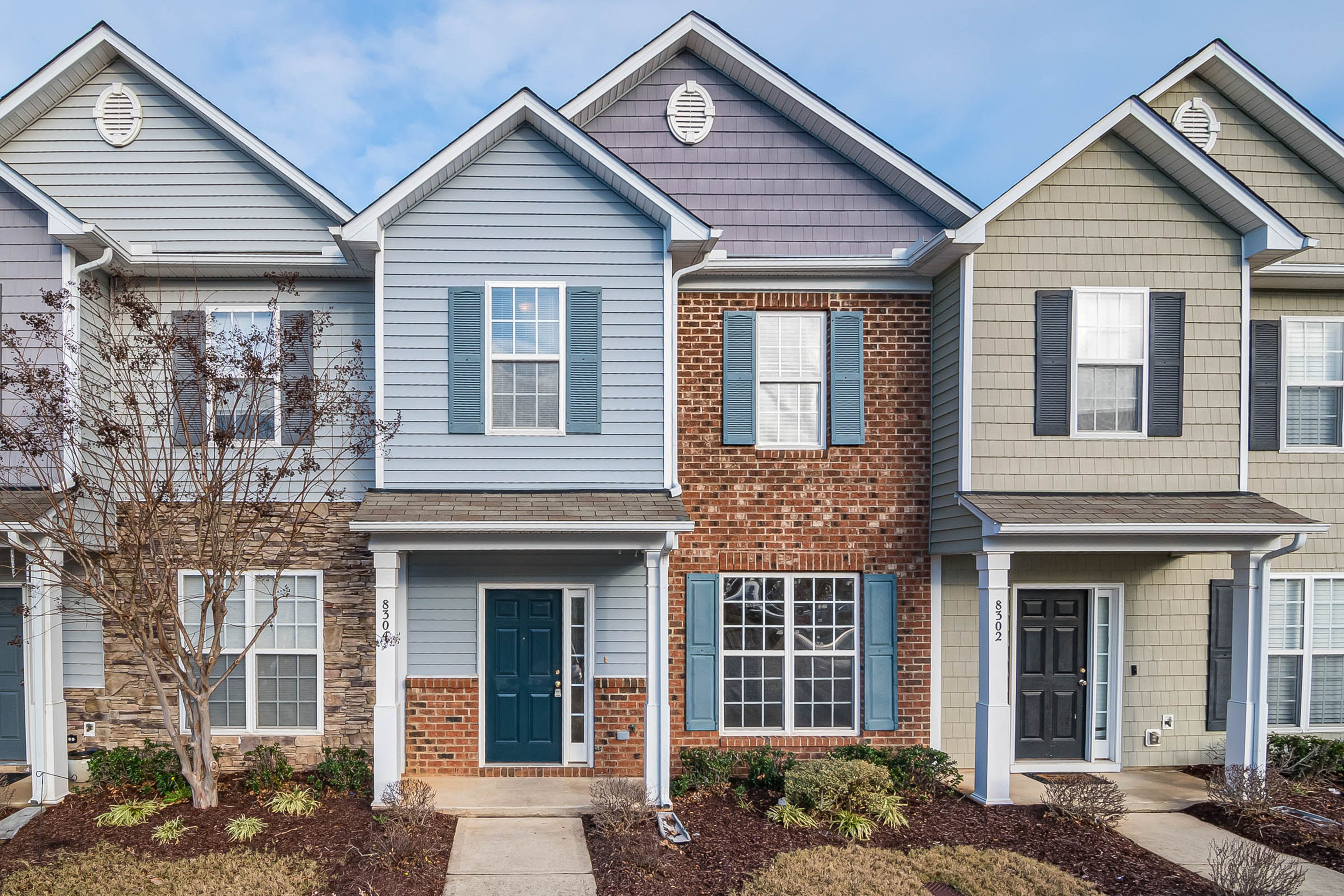 blue vinyl and red brick exterior painting